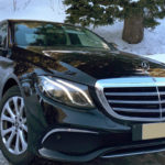 Photo of the Mercedes E class in the mountains with snow