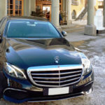 Photo of the Mercedes E class picking up a customer from home