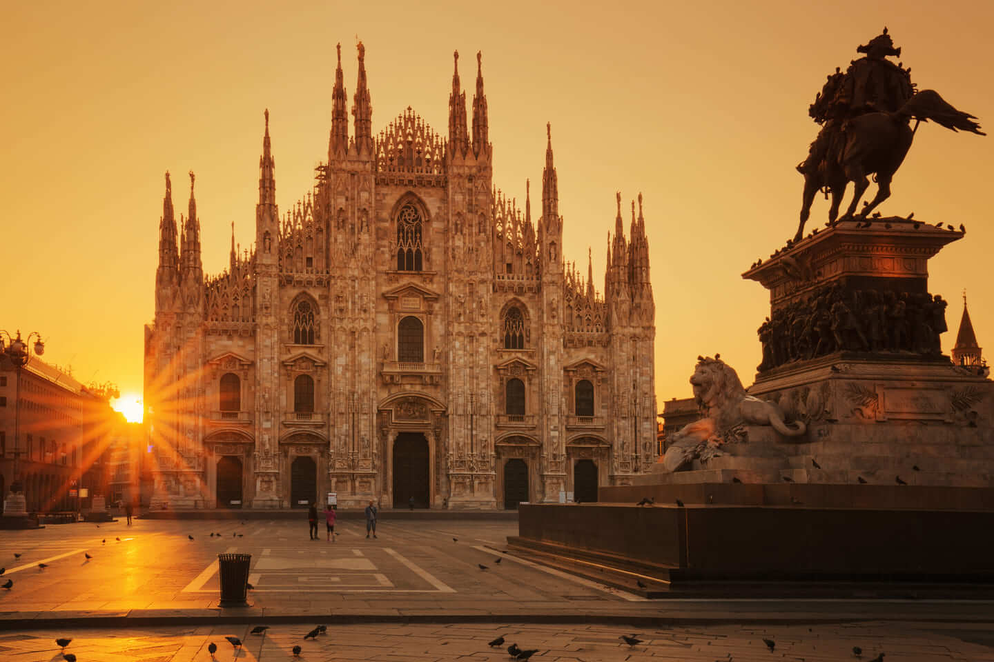 the cathedral of milan seen from the front with the sunset
